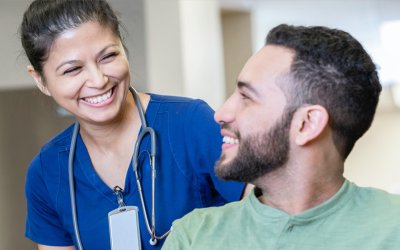 Nurse talking to patient about infusion therapy